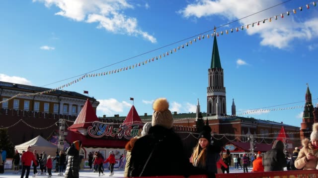 Young-girls-on-the-rink-are-photographed-against-the-background-of-the-Kremlin.