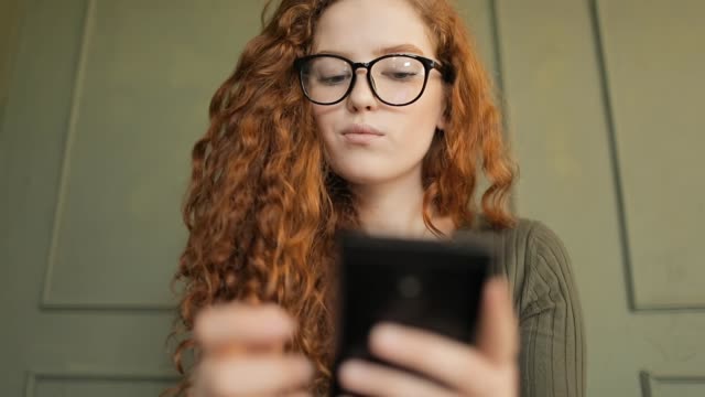 Girl-with-Curly-Hair-Texting