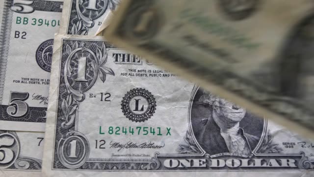 Laying-Dollar-Bills-Cash-on-Table-Slow-Motion