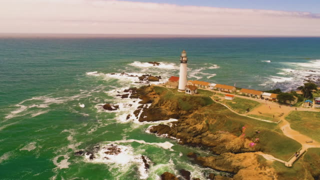 Light-House-Drone-Shot-aerial-Helicopter-view-ocean-coast-line-with-crashing-waves-sun-set-4K
