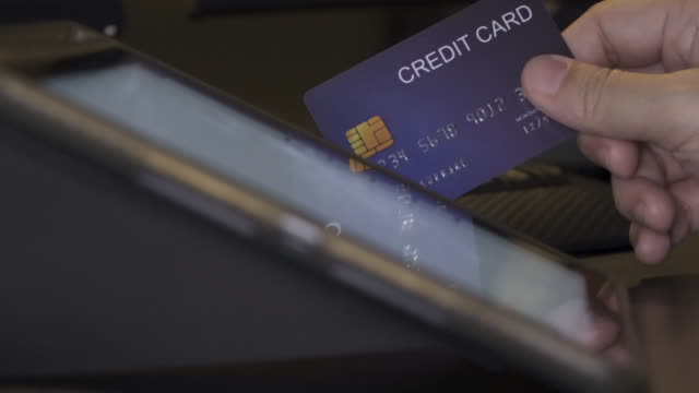 4K-Video-credit-card--touch-on-tablet-screen.