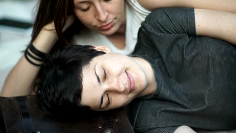 Close-up:-two-girls-kissing-on-a-cover-in-the-park