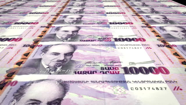 Banknotes-of-ten-thousand-armenian-drams-of-the-bank-of-Armenia-rolling-on-screen,-coins-of-the-world,-cash-money,-loop