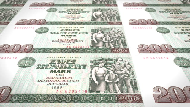 Banknotes-of-two-hundred-german-marks-or-deutschmarks-of-the-bank-of-the-old-German-republic-rolling-on-screen,-coins-of-the-world,-cash-money,-loop