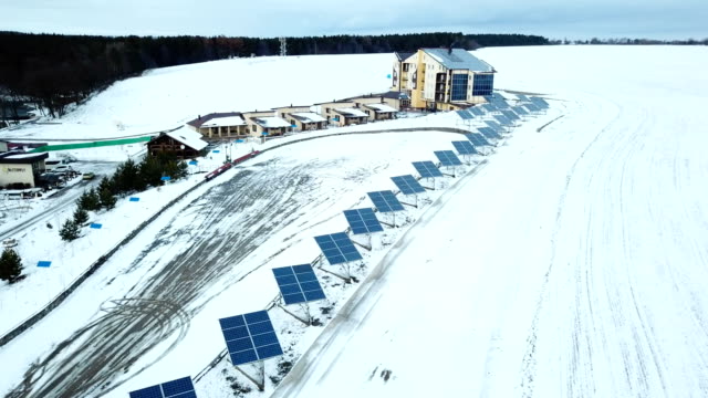 Recreation-center-with-solar-panels-covered-with-snow-on-the-outskirts-of-the-city.