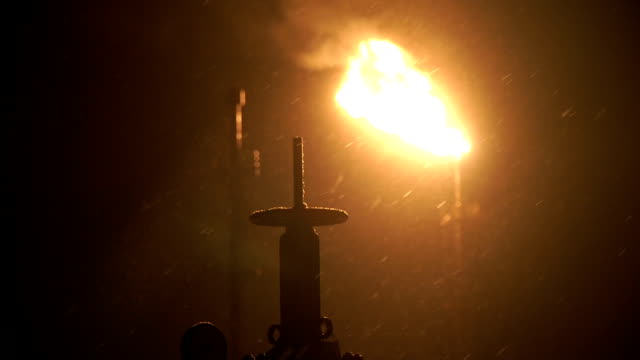 Oil,-gas-torch-at-night-in-the-taiga.