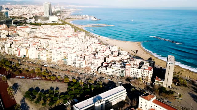 Top-view-of-the-modern-city-by-the-sea.-Stock.-Beautiful-city-on-the-beach-on-a-Sunny-day