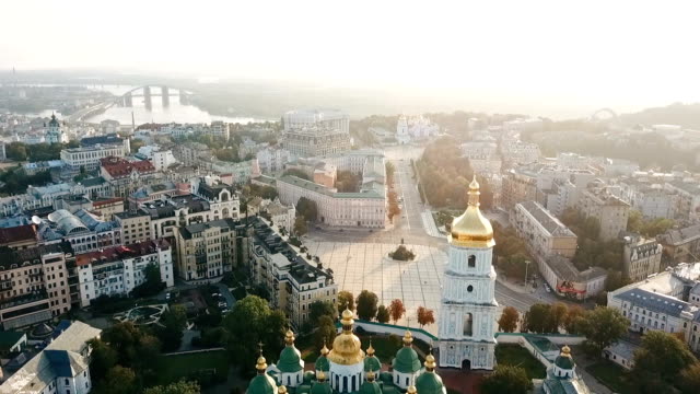 Saint-Sophia's-Cathedral,-square.-Kiev-Kiyv-Ukraine-with-Places-of-Interest.-Aerial-drone-video-footage.-Sunrise-light.-City-panarama.-Summer-time.-Dnipro-river-and-bridge.-City-center