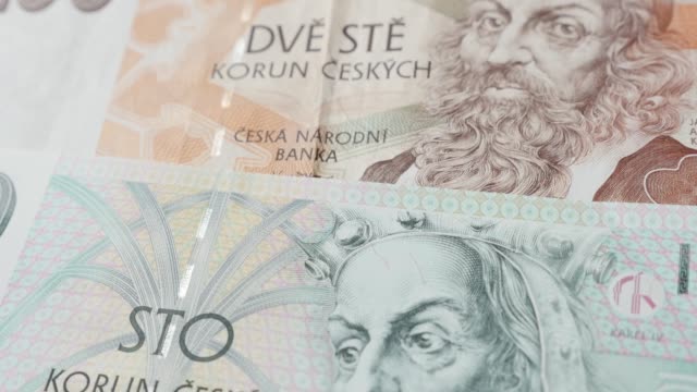 Shallow-DOF-national-Czech-Republic-koruna-currency-4K-2160p-30fps-UltraHD-tilting-footage---Slow-tilt-on-paper-denominations-of-Czechia-crown-banknotes-3840X2160-UHD-video