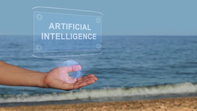 Hände-am-Strand-halten-Hologramm-Text-Künstliche-Intelligenz