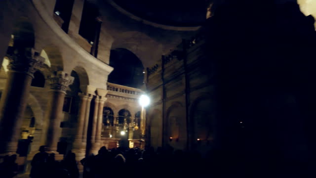 Pilgrims-and-tourists-are-waiting-to-enter-Aedicule-in-Church-of-the-Holy-Sepulchre,-the-world-greatest-Christian-shrine-in-Jerusalem,-Israel