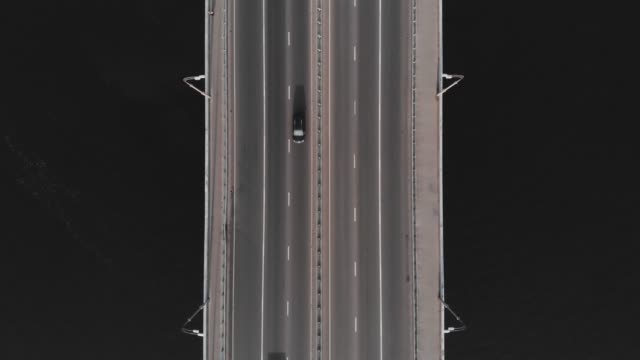 Highway-bridge-traffic-aerial-top-view-cars-passing-medium-speed