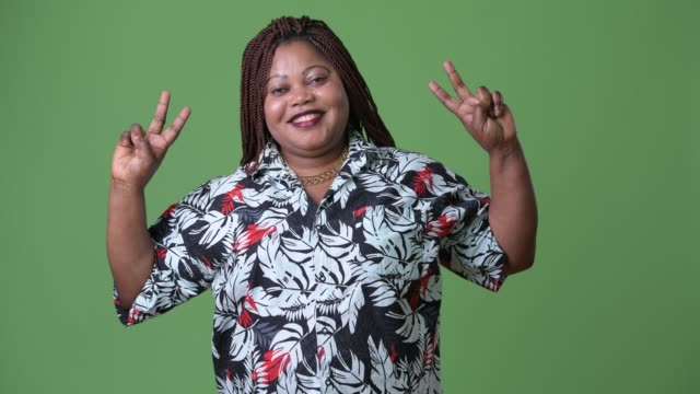 Overweight-beautiful-African-woman-against-green-background