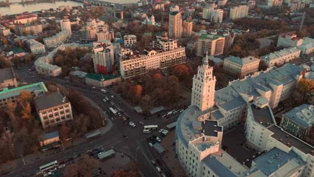 Aerial-panoramic-view-of-midtown-of-Voronezh-city-at-sunset,-Russia.-Famous-buildings-and-urban-architecture-with-roads-and-car-traffic