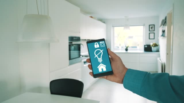 Smart-home-app-on-mobile-phone-wirelessly-controls-light-bulbs-in-lamps