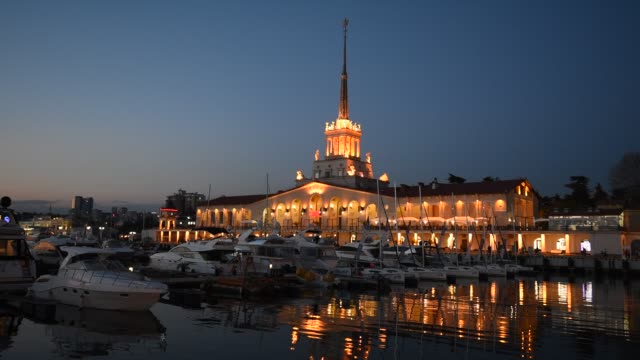 Marine-Station-at-seaport-and-the-Black-Sea-in-the-Night-in-Sochi,-Russia
