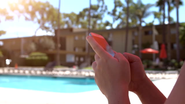 Woman-using-phone-on-the-vacations-in-slow-motion-120fps