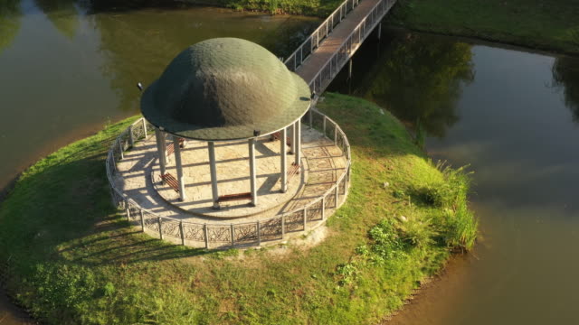Theophania-Park,-a-gazebo-on-a-small-island-in-the-middle-of-the-lake,-top-view,-drone-flight