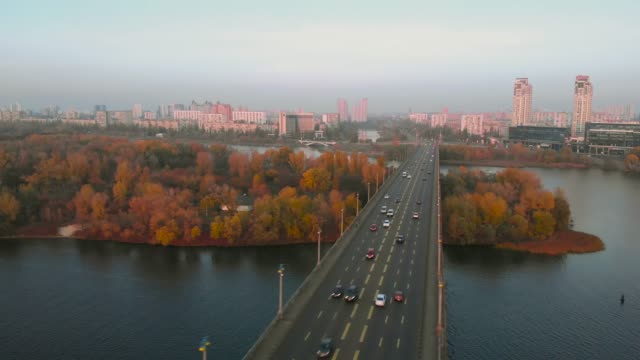 Drone-flying-over-an-automobile-bridge-at-sunset
