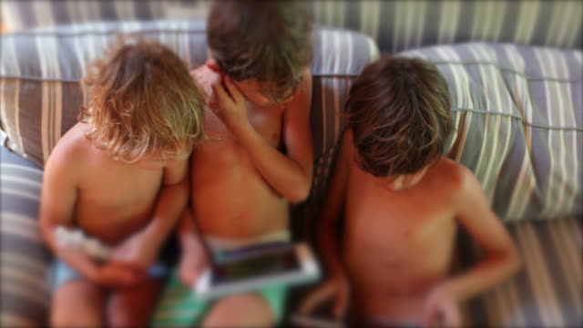 Children-using-tablet-device-at-home--candid-and-authentic