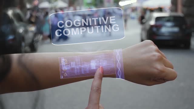 Female-hand-activates-hologram-Cognitive-computing