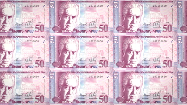 Banknotes-of-fifty-armenian-drams-of-the-bank-of-Armenia-rolling-on-screen,-coins-of-the-world,-cash-money,-loop