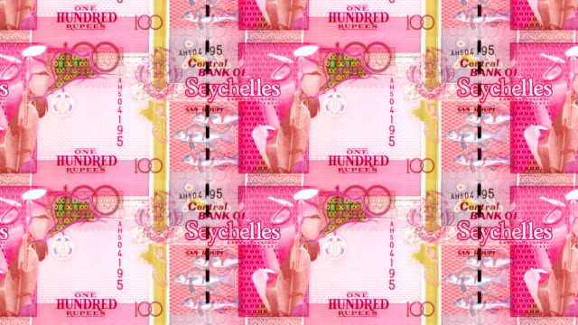 Series-of-banknotes-of-one-hundred-rupees-of-the-bank-of-the-Seychelles-Island-rolling-on-screen,-coins-of-the-world,-cash-money,-loop