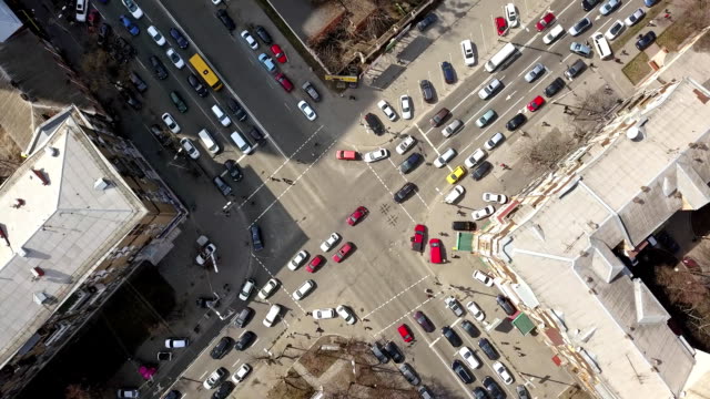 view-of-intersection-of-streets-in-Kiev-with-cars,-taxis,-bus-and-people-from-above-in-FullHD