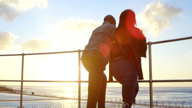 Couple-standing-near-railing-on-a-sunny-day-4k