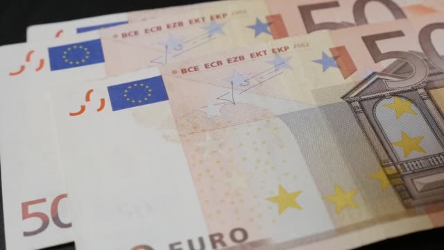 Money-counting-lot-of-different-Euro-banknotes-slow-mo-1080p-FullHD-footage---Slow-motion-European-Union-currency-falling-on-table-1920X1080-HD-video
