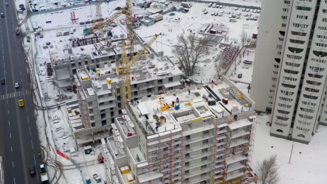 Aerial-view-of-building-construction-site-in-winter