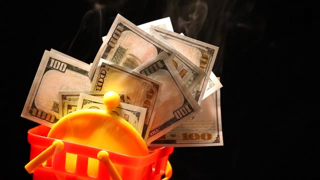 yellow-purse-money-dollar-plastic-basket-smoke-nobody-dark-background-hd-footage