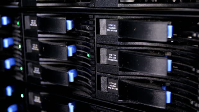 closeup-motion-past-crypto-mining-servers-with-green-and-blue-lights