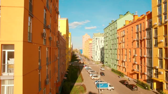 Flying-over-cozy-comfortable-colorful-buildings-in-a-European-city-4K-UHD-aerial