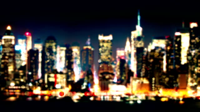 Night-city-background,-brightly-illuminated-skyscrapers-and-street-traffic