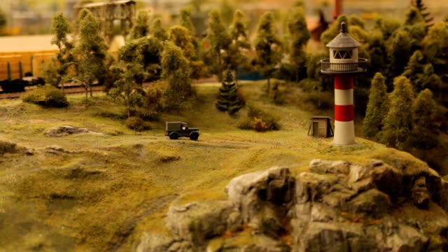 Spielzeug-Stadt-Nahaufnahme-Leuchtturm-Strand-Küste