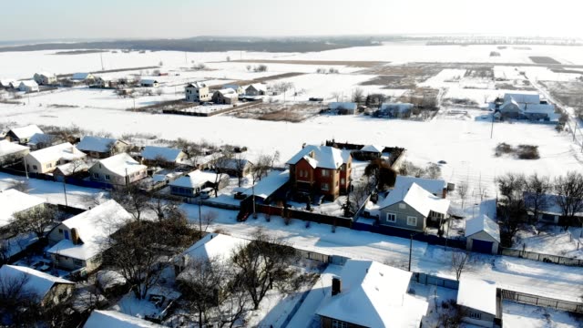 CHERKASY-REGION,-UKRAINE,-DECEMBER-25,-2018:-winter,-snow-covered-streets,-houses.-frosty-sunny-day.-aero,-view-from-above