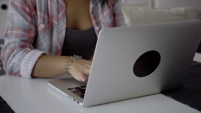 Cropped-shot-of-female-hands-typing-on-laptop.