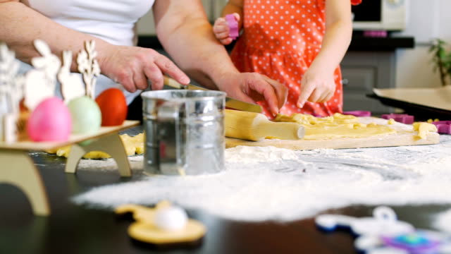 Grandmother-Helping-Granddaughter-make-Cookies