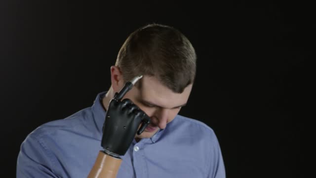Confident-Man-with-Prosthetic-Arm-Posing-for-Camera