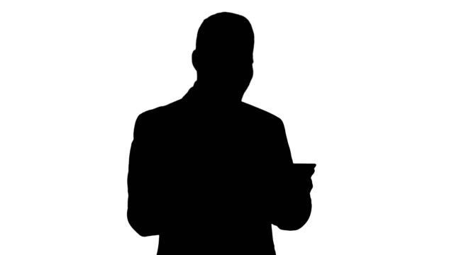 Silhouette-Businessman-Reading-or-Working-on-a-digital-tablet