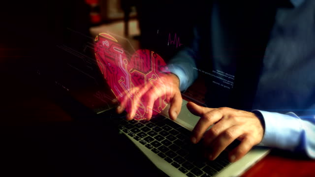 Hombre-escribiendo-en-el-teclado-con-holograma-símbolo-del-corazón