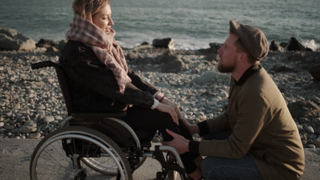 Man-expressing-love-to-his-handicapped-girlfriend