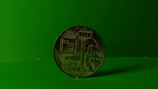 Gold-Bit-Coin-BTC-coins-rotating-on-green-background,