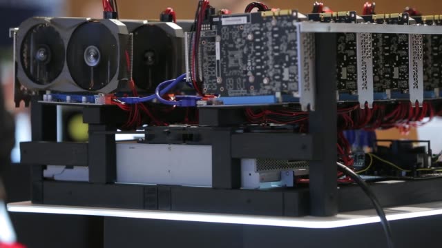 Cryptocurrency-mining-equipment-rig---lots-of-gpu-cards-on-mainboard