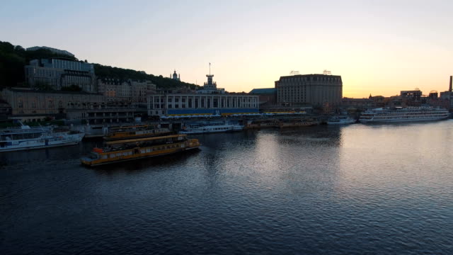 Excursion-passenger-ship-sails-to-the-port-of-the-old-European-city-at-sunset