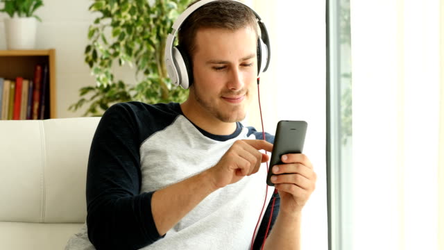 Guy-listening-music-relaxing-at-home