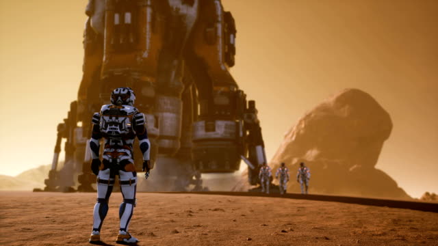 The-astronaut-is-waiting-for-other-astronauts-who-have-just-landed-on-Mars-in-a-rocket.-Panoramic-landscape-on-the-surface-of-Mars.-Realistic-cinematic-animation.