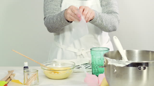Mixing-royal-icing-to-decorate-Easter-sugar-cookies