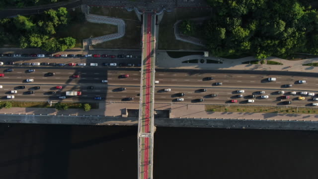 Freeway-busy-city-rush-hour-heavy-traffic-jam-highway.-Aerial-view-of-the-vehicular-intersection,-traffic-at-peak-hour-with-cars-on-the-road,-over-the-bridge